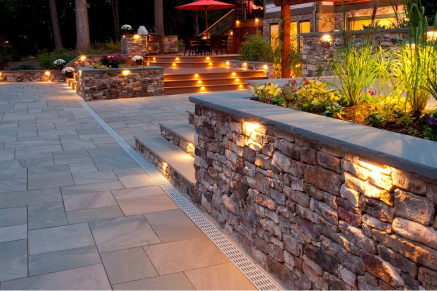 Integrating Landscaping and Lighting with Your Stone Retaining Walls